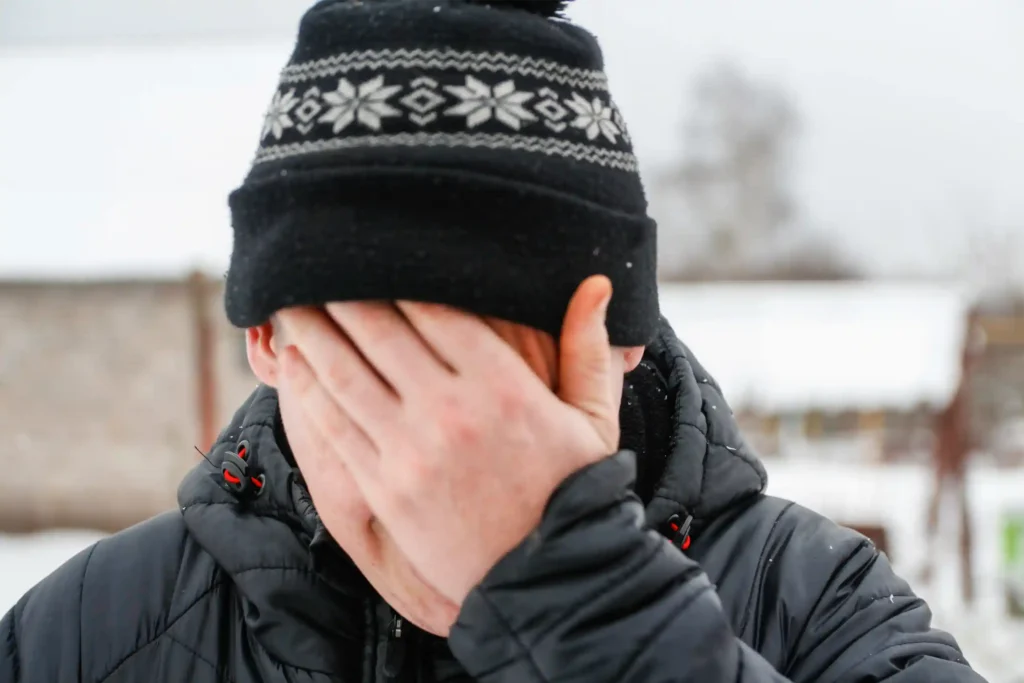 Person looking fatigued during winter months in Canada, illustrating symptoms of winter depression