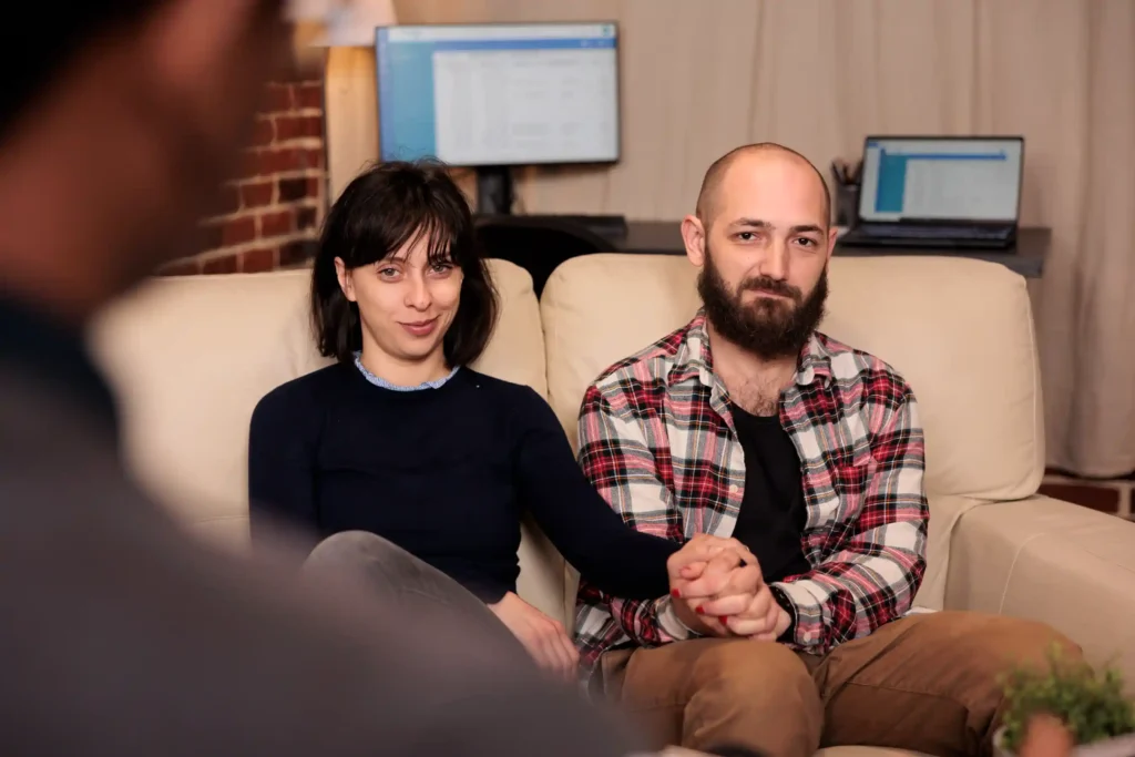 Couple holding hands, showing emotional connection and support